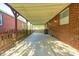 This covered patio features a fenced enclosure and offers an inviting outdoor living space at 319 S Webster Ave, Indianapolis, IN 46219