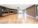 Spacious basement featuring unique climbing wall, light hardwood flooring and custom shelving at 3711 Tara Ct, Carmel, IN 46074