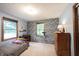 A bright bedroom offers a star ceiling, two large windows and neutral carpet at 3711 Tara Ct, Carmel, IN 46074