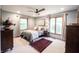 A relaxing bedroom features a comfortable bed, neutral walls, and wood trim at 3711 Tara Ct, Carmel, IN 46074