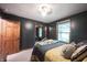 A cozy bedroom features grey walls with a star pattern and natural light at 3711 Tara Ct, Carmel, IN 46074