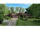 Charming brick ranch with well-maintained landscaping and a two-car garage at 3711 Tara Ct, Carmel, IN 46074