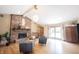 Bright living area featuring hardwood floors, a brick fireplace, comfortable seating and backyard access at 3711 Tara Ct, Carmel, IN 46074