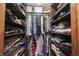 A walk-in closet features built-in shelving and ample storage space for clothes at 3711 Tara Ct, Carmel, IN 46074