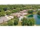 Aerial view of home with pool, pond and lush green backyard at 3893 Bent Tree Ln, Greenwood, IN 46143