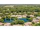 Stunning aerial view of pond, lush landscaping, and neighborhood at 3893 Bent Tree Ln, Greenwood, IN 46143