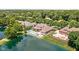 Aerial view of lush backyard with pool, pond, and outdoor living at 3893 Bent Tree Ln, Greenwood, IN 46143
