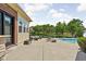 Spacious backyard with pool, patio furniture, and pond at 3893 Bent Tree Ln, Greenwood, IN 46143