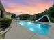 Backyard pool area, with a slide and relaxing seating near the lake providing the perfect spot for summer fun at 3893 Bent Tree Ln, Greenwood, IN 46143