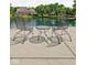 Backyard patio with bistro table and chairs overlooking a scenic pond at 3893 Bent Tree Ln, Greenwood, IN 46143