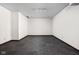 Unfurnished basement area with gray carpet, white walls, and track lighting at 3893 Bent Tree Ln, Greenwood, IN 46143