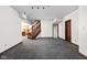 Spacious basement with carpet flooring, staircase, and view to cozy living area at 3893 Bent Tree Ln, Greenwood, IN 46143