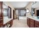 Bright bathroom featuring tile floors, soaking tub, and vanity at 3893 Bent Tree Ln, Greenwood, IN 46143