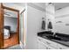 Bathroom featuring a large mirror, dark stone vanity, and an adjoining shower at 3893 Bent Tree Ln, Greenwood, IN 46143