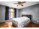 Comfortable bedroom with hardwood floors, a large window, and neutral wall color at 3893 Bent Tree Ln, Greenwood, IN 46143