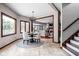 Charming breakfast nook with large windows offering scenic views, adjacent to living area and staircase at 3893 Bent Tree Ln, Greenwood, IN 46143