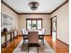 Formal dining room with hardwood floors, a stylish table, and plenty of natural light at 3893 Bent Tree Ln, Greenwood, IN 46143