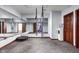 Home exercise room with mirrored wall, trampoline, and aerial yoga equipment at 3893 Bent Tree Ln, Greenwood, IN 46143