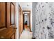 Hallway featuring tile floors and wood trim doors leading to adjoining rooms at 3893 Bent Tree Ln, Greenwood, IN 46143