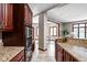 Spacious kitchen with granite countertops, stainless steel appliances, and seamless transition to dining area at 3893 Bent Tree Ln, Greenwood, IN 46143
