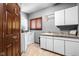 Functional laundry room featuring white appliances, storage, and tile flooring at 3893 Bent Tree Ln, Greenwood, IN 46143