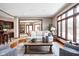 Open-concept living area with comfortable seating, hardwood floors, and a view into the dining and kitchen at 3893 Bent Tree Ln, Greenwood, IN 46143