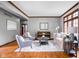 Comfortable living room featuring hardwood floors, neutral decor, and ample natural light for a cozy space at 3893 Bent Tree Ln, Greenwood, IN 46143