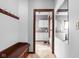 Mudroom with a built-in bench, coat hooks and tile floors at 3893 Bent Tree Ln, Greenwood, IN 46143