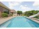 Inviting backyard pool with slide and a view of the pond at 3893 Bent Tree Ln, Greenwood, IN 46143