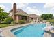 Backyard pool with slide, pond view, and inviting outdoor space at 3893 Bent Tree Ln, Greenwood, IN 46143