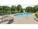 Backyard pool with slide, pond view and lounge chairs at 3893 Bent Tree Ln, Greenwood, IN 46143