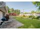Backyard with a patio, large grassy area and shade trees, perfect for outdoor activities and relaxation at 4020 Eisenhower Dr, Indianapolis, IN 46254