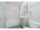 Bathroom with a shower and tub, showcasing a tiled wall and modern vanity at 4020 Eisenhower Dr, Indianapolis, IN 46254