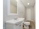Bathroom featuring a vanity and toilet, plus a large mirror for getting ready in the morning at 4020 Eisenhower Dr, Indianapolis, IN 46254