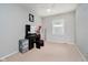 Neutral bedroom provides a serene space, complemented by a large window for natural light at 4020 Eisenhower Dr, Indianapolis, IN 46254