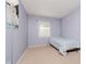 Cozy bedroom with soothing lavender walls, creating a tranquil and inviting atmosphere at 4020 Eisenhower Dr, Indianapolis, IN 46254