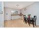 Dining area featuring wood floors, a black table with chairs, and lots of natural light at 4020 Eisenhower Dr, Indianapolis, IN 46254