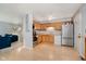 Functional kitchen with light wood cabinets, stainless steel appliances, and durable flooring at 4020 Eisenhower Dr, Indianapolis, IN 46254