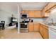 Bright kitchen features stainless steel appliances and a breakfast bar, perfect for casual dining at 4020 Eisenhower Dr, Indianapolis, IN 46254