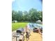 Large, grassy backyard features a covered pool and grill, perfect for outdoor entertaining at 430 N Greenbriar Dr, Greenwood, IN 46142
