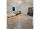 Spacious bedroom with ceiling fan and carpeted floors; includes a cabinet for extra storage at 430 N Greenbriar Dr, Greenwood, IN 46142