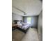 This cozy bedroom features a ceiling fan and a natural light-filled window at 430 N Greenbriar Dr, Greenwood, IN 46142