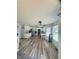 Bright eat-in kitchen features stainless steel appliances, white cabinetry, and wood-look flooring at 430 N Greenbriar Dr, Greenwood, IN 46142