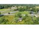 Scenic aerial view captures property amidst open fields, train tracks, and neighborhood at 4305 Five Points Rd, Indianapolis, IN 46239