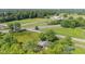 Aerial view highlighting the location including barn, pond, train tracks, access roads, and nearby residences at 4305 Five Points Rd, Indianapolis, IN 46239