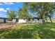 Expansive backyard with lush lawn and mature trees at 4305 Five Points Rd, Indianapolis, IN 46239