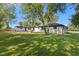 Lush backyard featuring green grass and scattered trees at 4305 Five Points Rd, Indianapolis, IN 46239