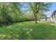Large grassy backyard with mature trees at 4305 Five Points Rd, Indianapolis, IN 46239