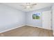 Bright bedroom with light blue walls and a large window for natural light at 4305 Five Points Rd, Indianapolis, IN 46239