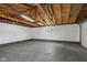 Spacious two car garage featuring a concrete floor, overhead lighting, and a compact window at 4305 Five Points Rd, Indianapolis, IN 46239
